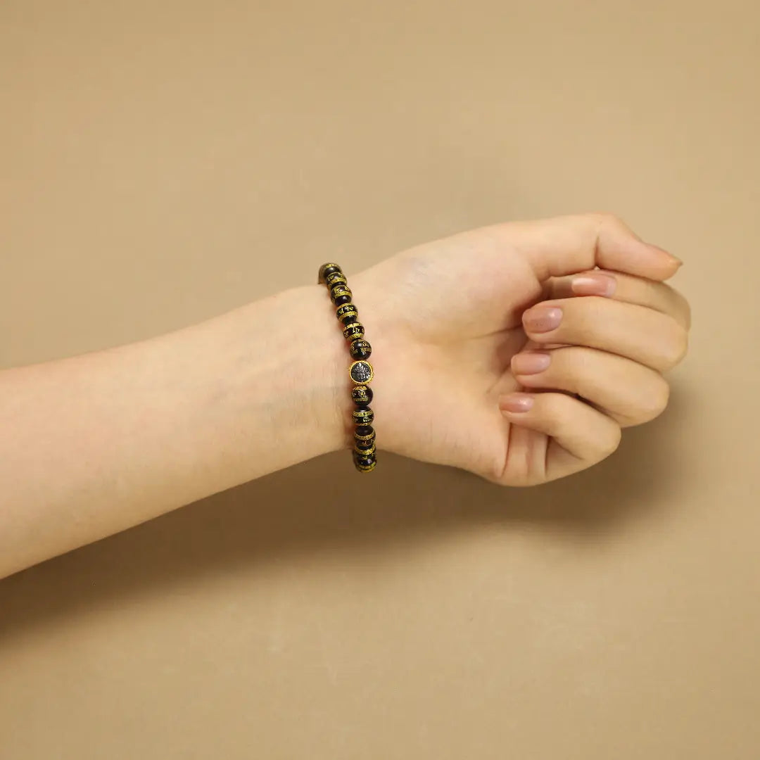 6.5mm Blood Amber Bracelet with Six-Word Mantra & Yellow Jambhala