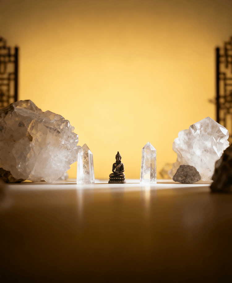 The Peaceful Buddha Statue is Nestled Among Clear Quartz Rough Crystal-Representing Blessing and Harmony
