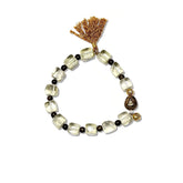 Faceted natural Citrine crystal bracelet featuring a brown tassel and vintage metal charm.