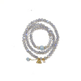 Natural labradorite beaded wrap bracelet featuring a gold triangle charm and small pearl accent.