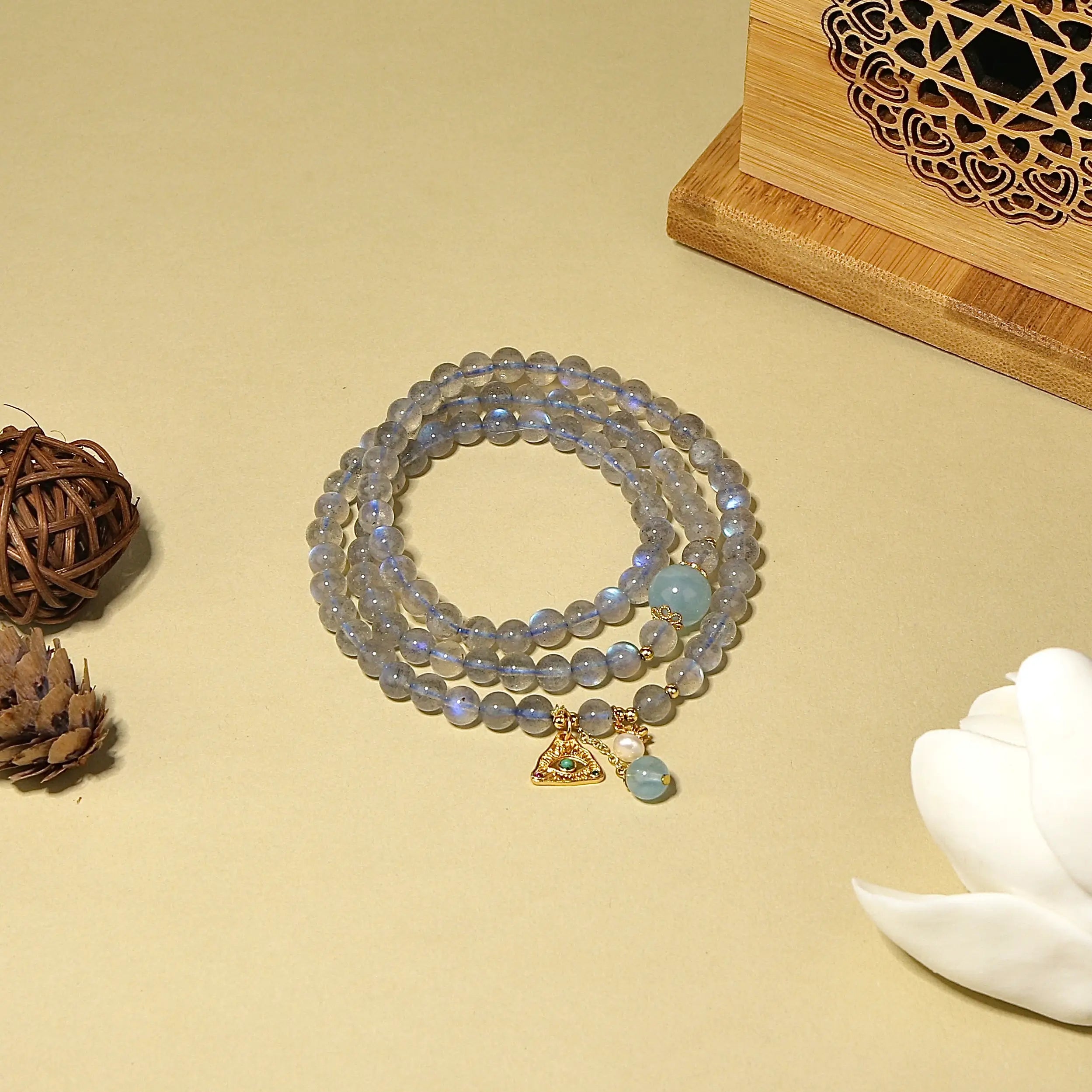 Natural labradorite beaded wrap bracelet featuring a gold triangle charm and small pearl accent.