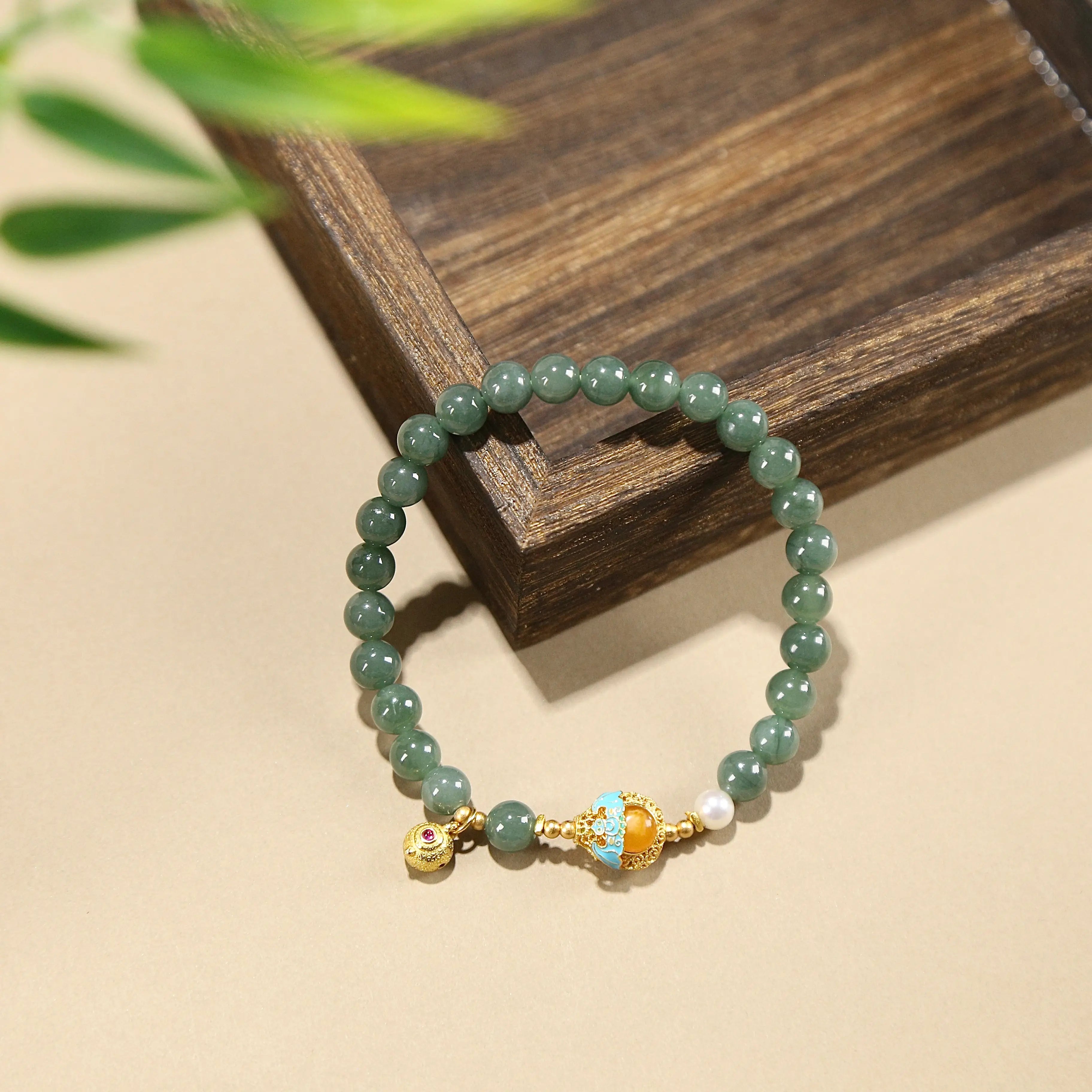 7mm Blue Jadeite bracelet named Serenity & Elegance, featuring a floral bead charm on white background.