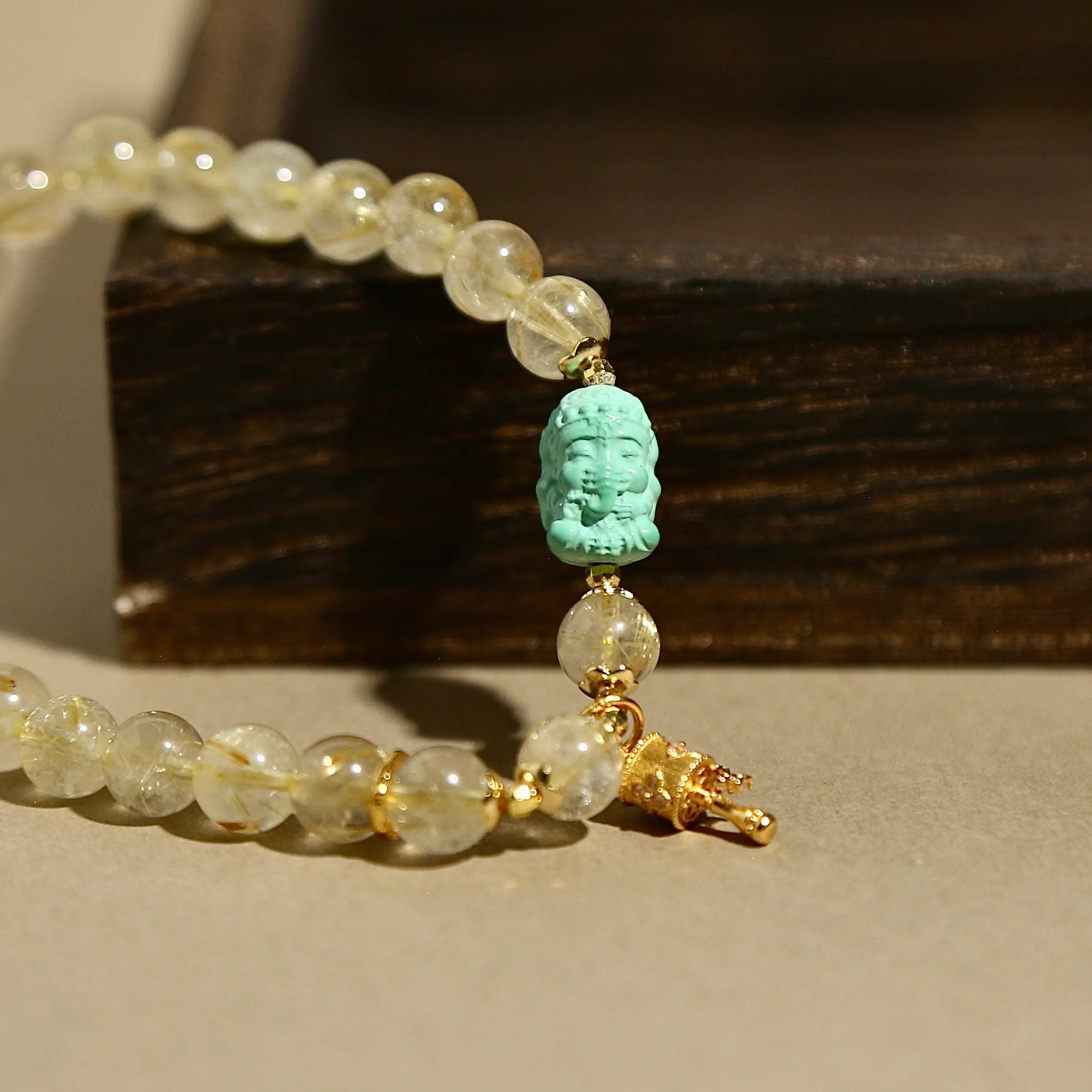 7mm Golden Rutilated Quartz Bracelet with Green Agate Ganesha & Prayer Wheel